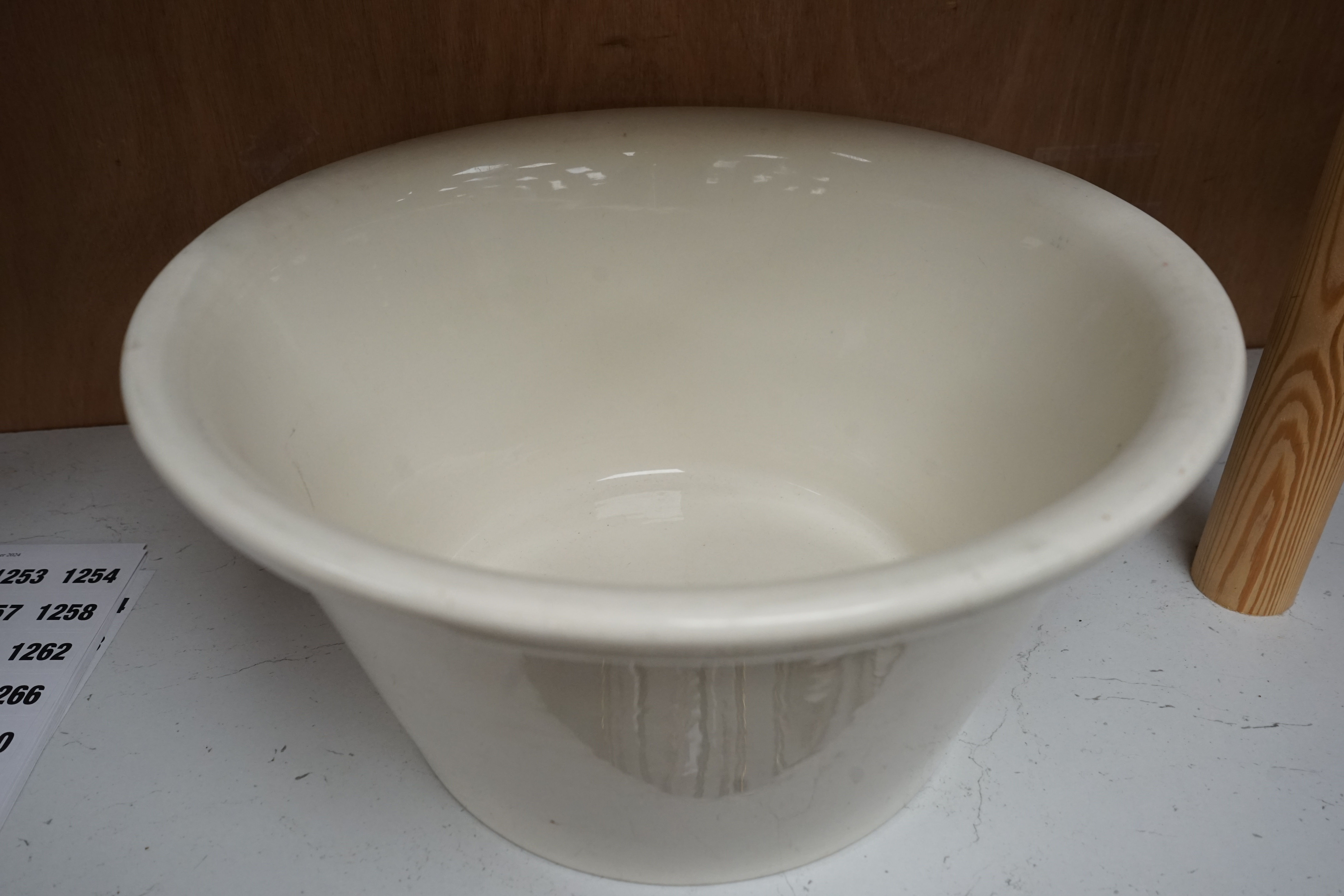 A Dairy Supply Co. Ltd 'New Milk' cream glazed dairy bowl, 34cm diameter. Condition - some marks to top edge of bowl.